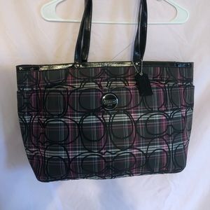 Coach purple and black diaper bag.